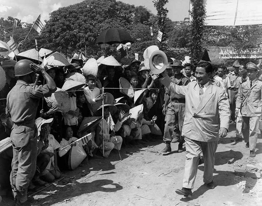 South Vietnam Premier Ngo Dinh Diem, winner in the recent battle for power at Saigon, exchanges greetings with villagers during a recent visit to the Indochina coastal town of Binh Dinh, Vietnam on June 12, 1955. Diem appears well on his way to ousting the French from control in South Vietnam, strategic Southeast Asia area coveted by the communists. (AP Photo/Fred Waters )